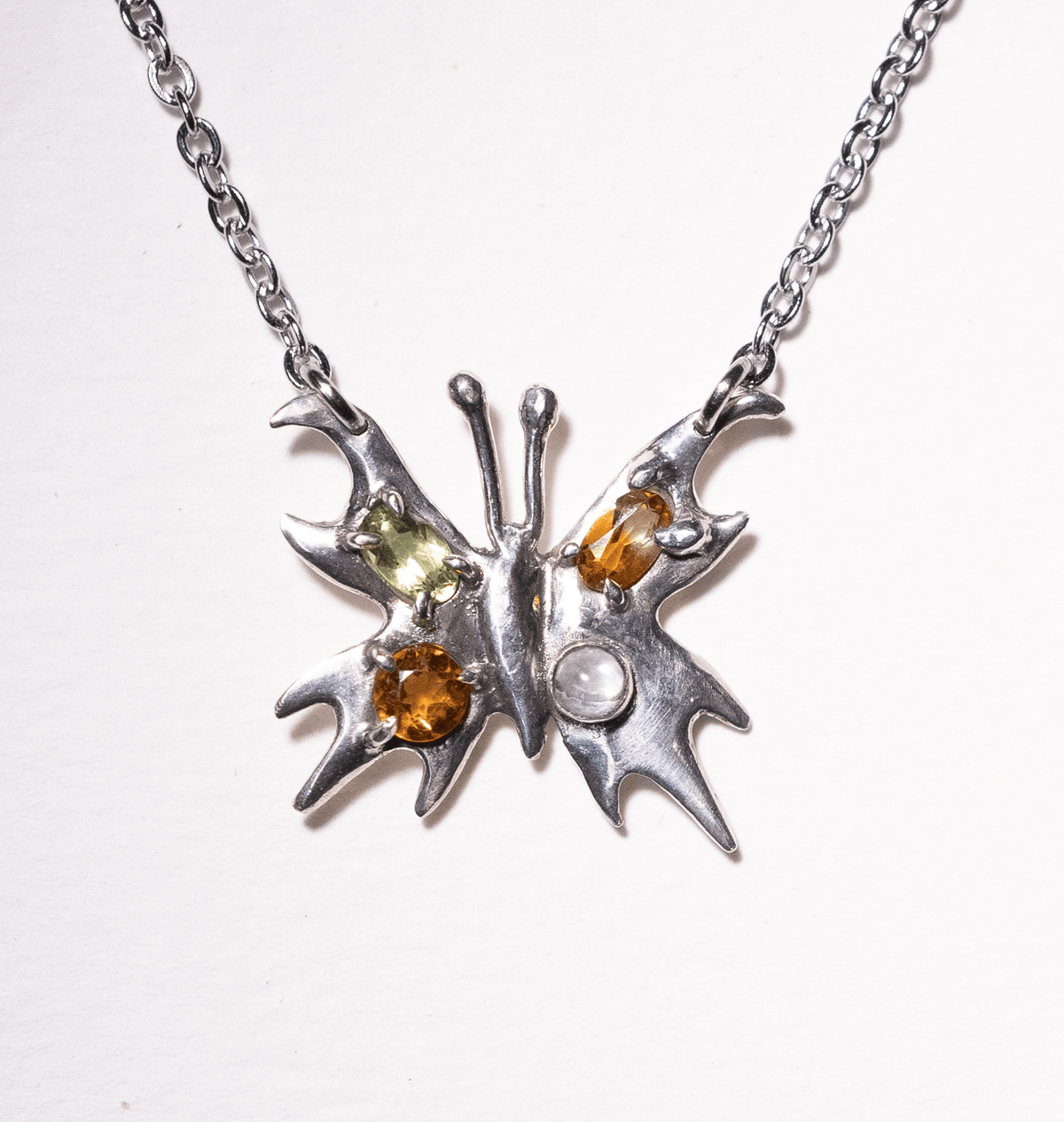 Chrome Pappillion Necklace with Orange Stones