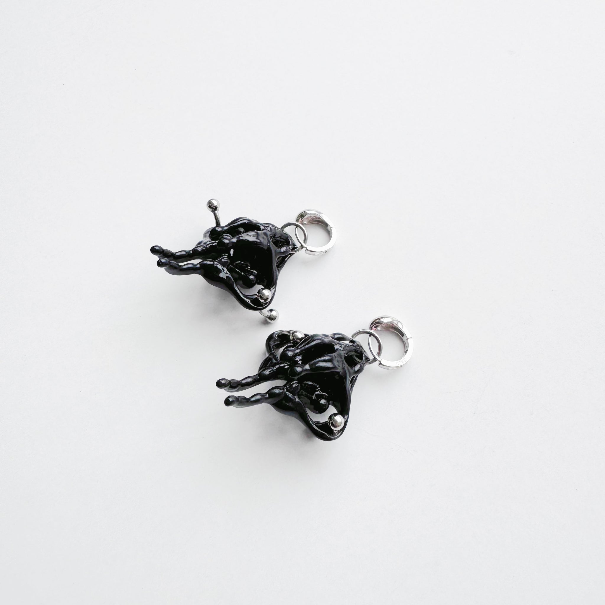 Black Piercing Pelvis Earrings