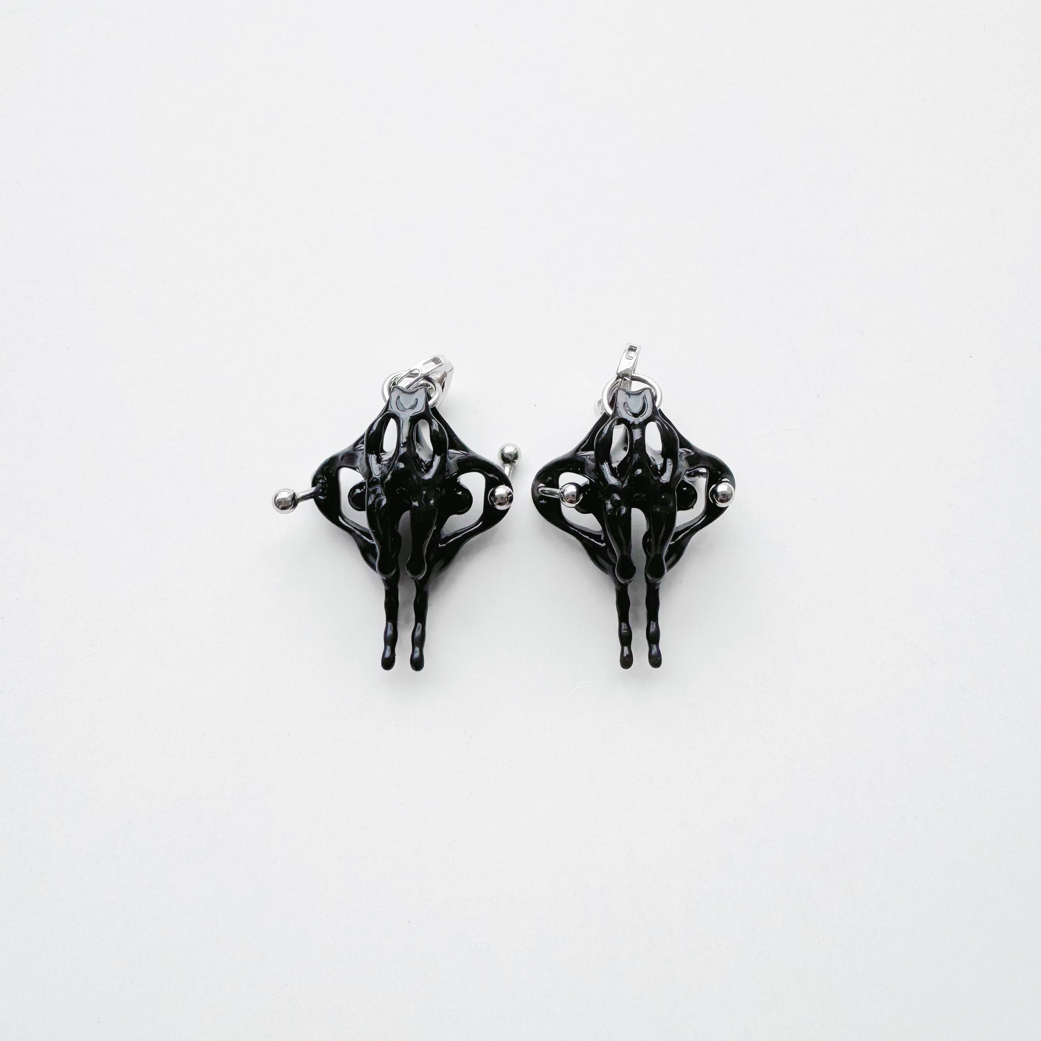 Black Piercing Pelvis Earrings