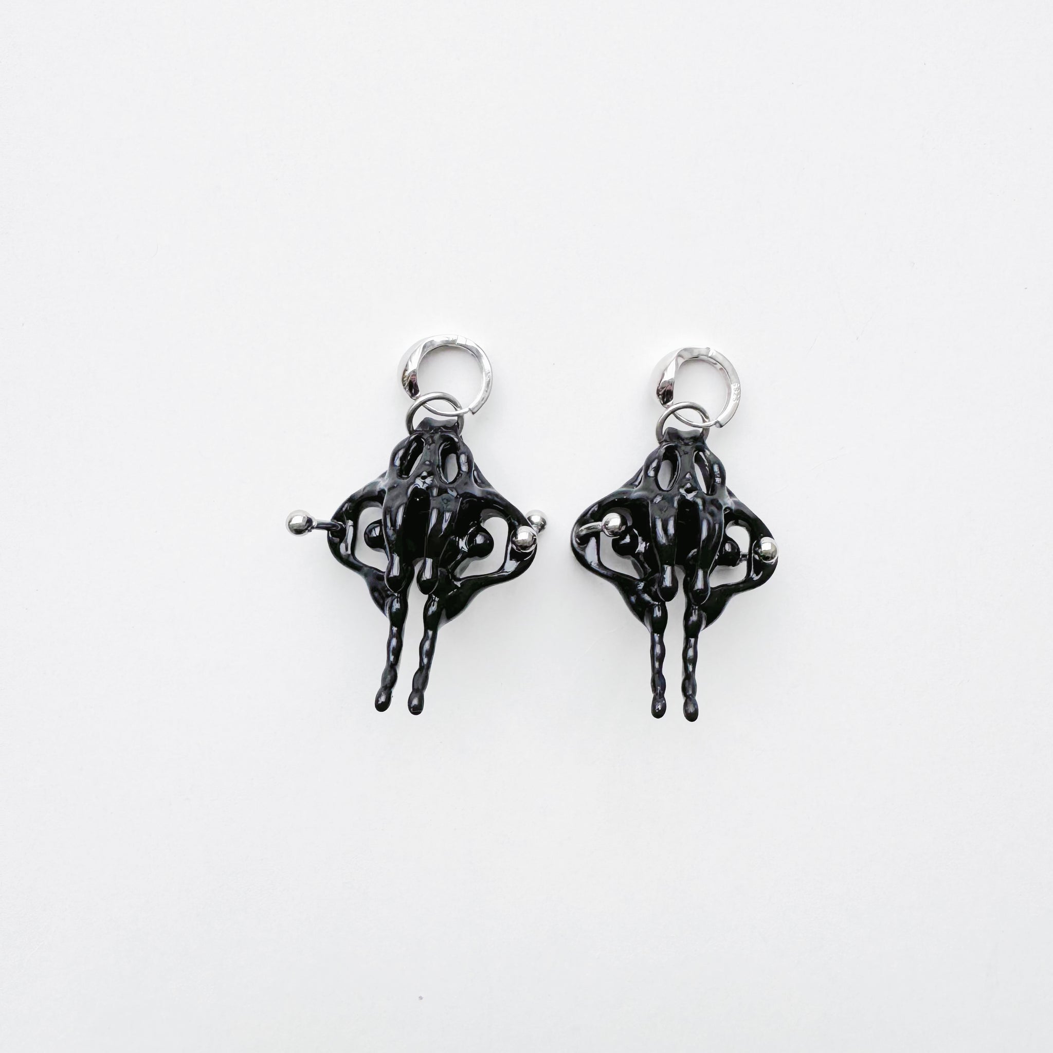 Black Piercing Pelvis Earrings