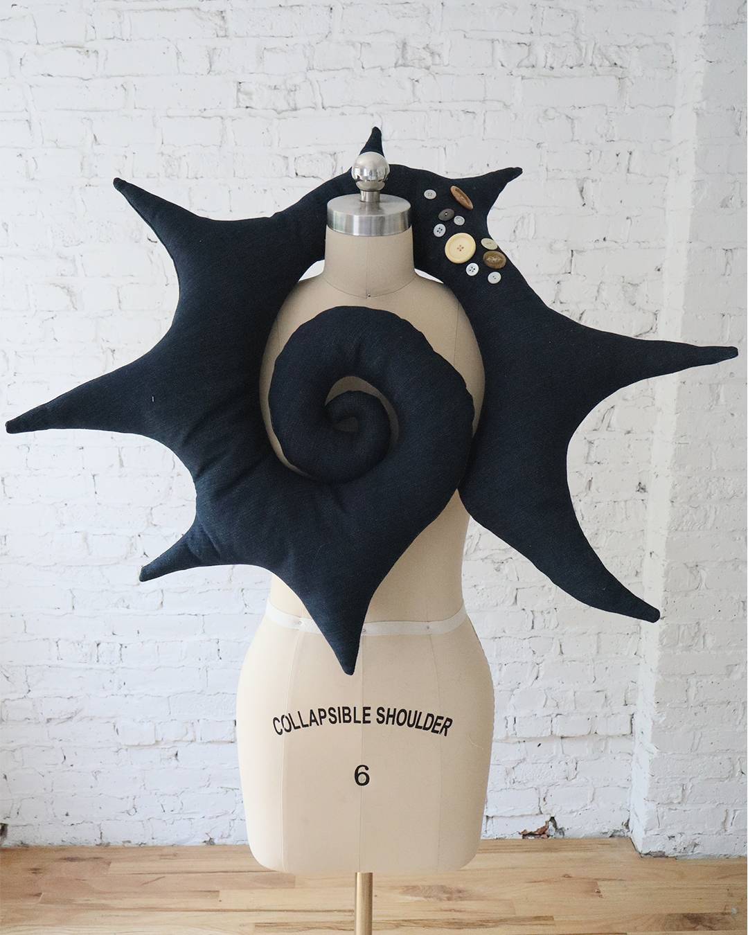 Spiral Pillow in Buttoned Denim