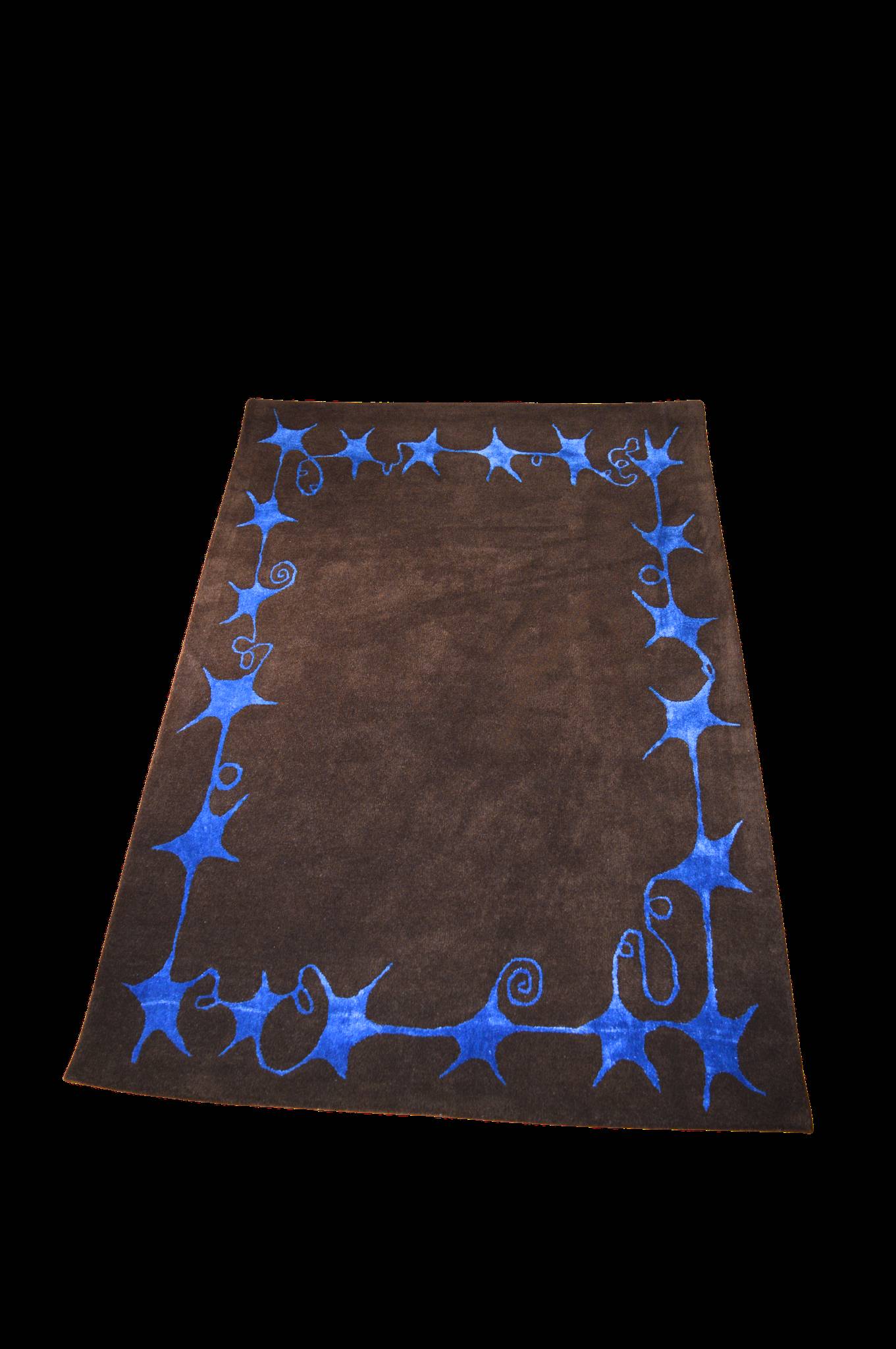 The Swirly Star Rug in Brown