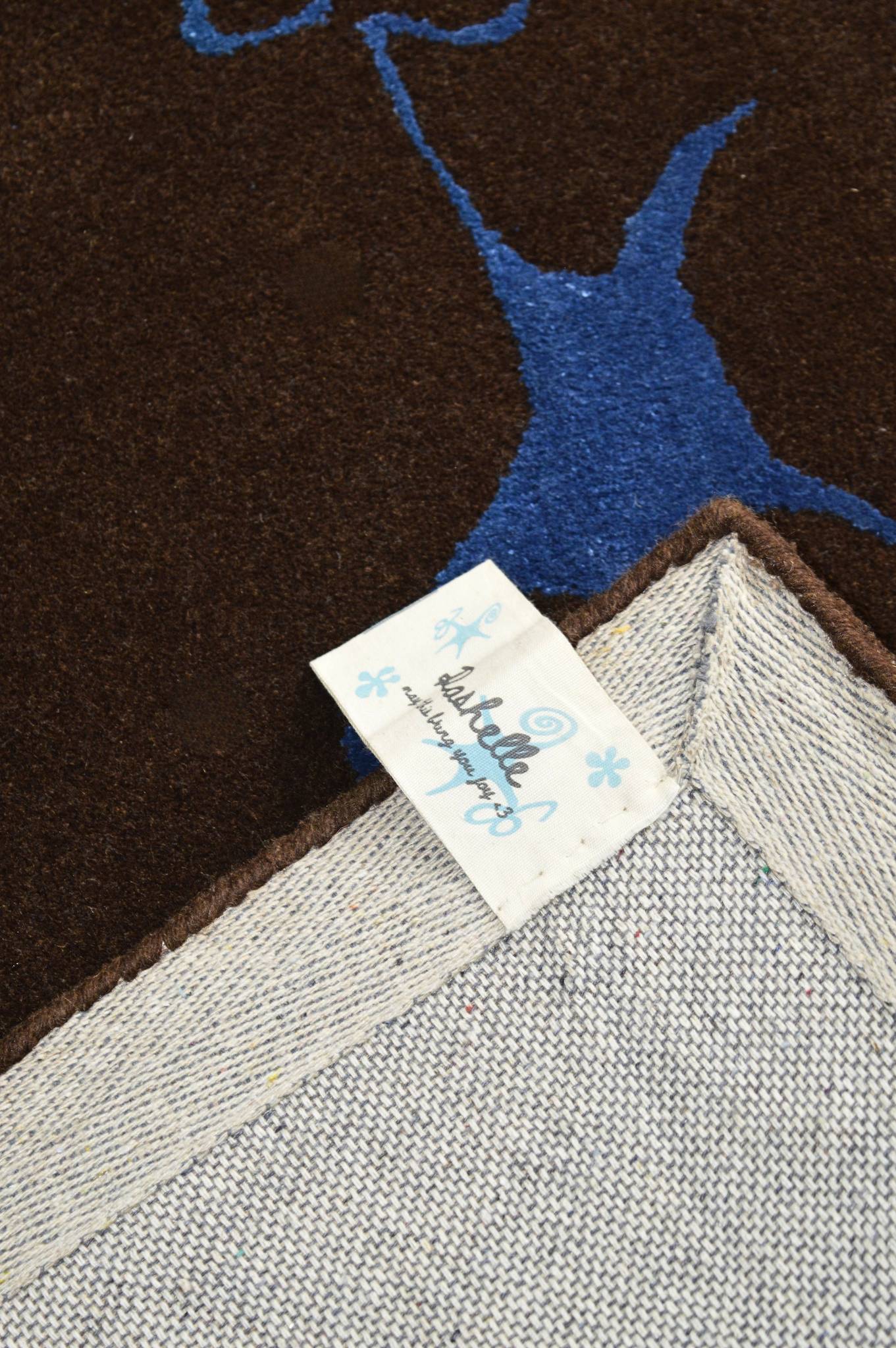 The Swirly Star Rug in Brown